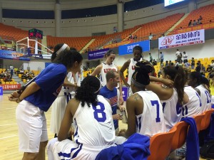 Team and Coaches in Huddle